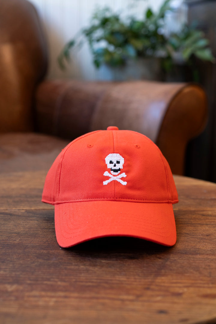 Harding  Lane, Skull & Bones hat on neon red